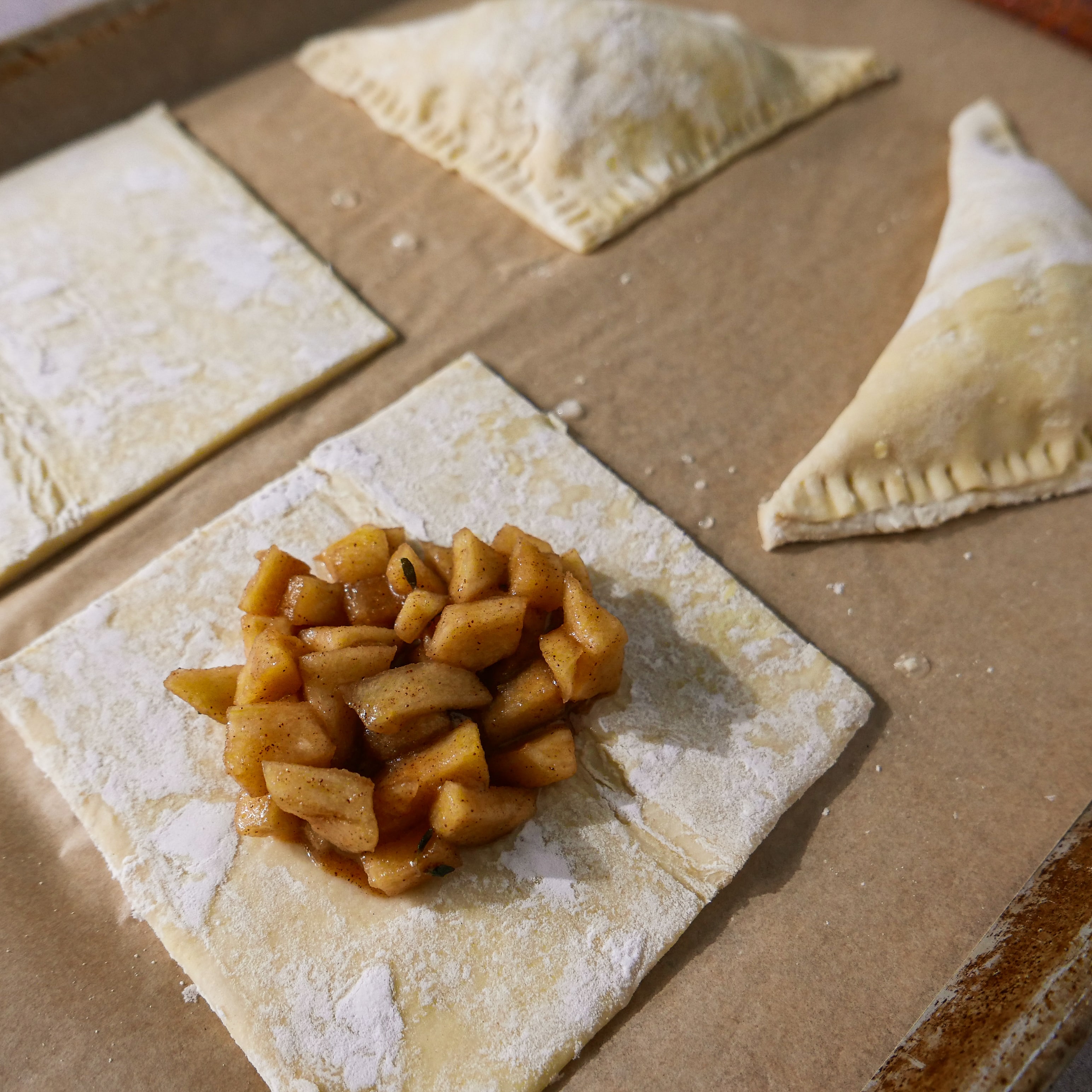 apple-pastries.jpg Puff pastry squares filling with apple filling.