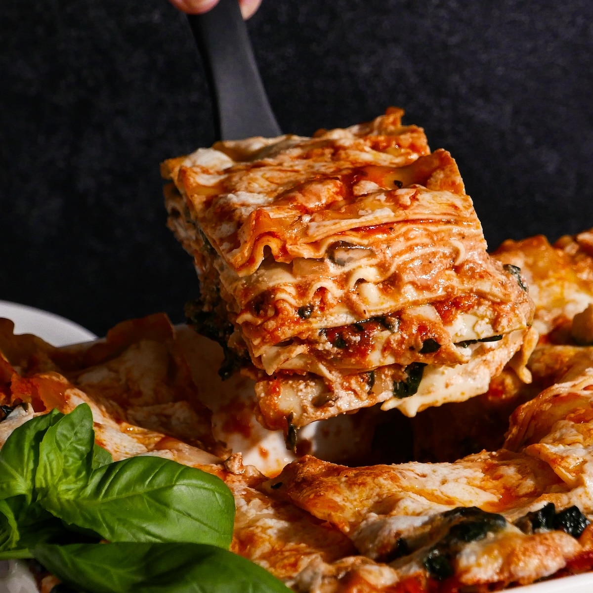 Cheesy lasagna with mushrooms and zucchini.