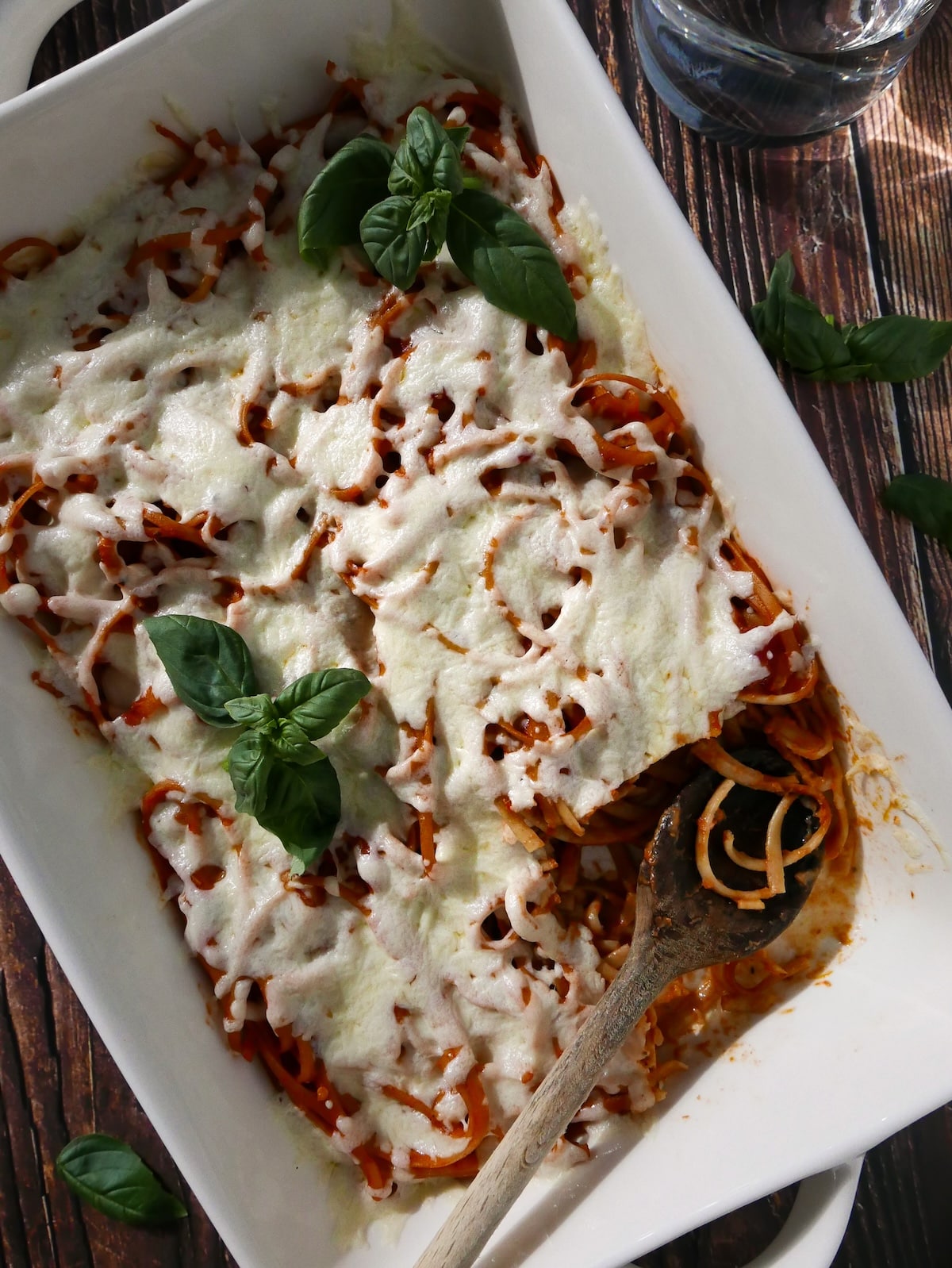 baked-leftover-spaghetti.jpg Baked leftover spaghetti in a baking dish with a large spoon.