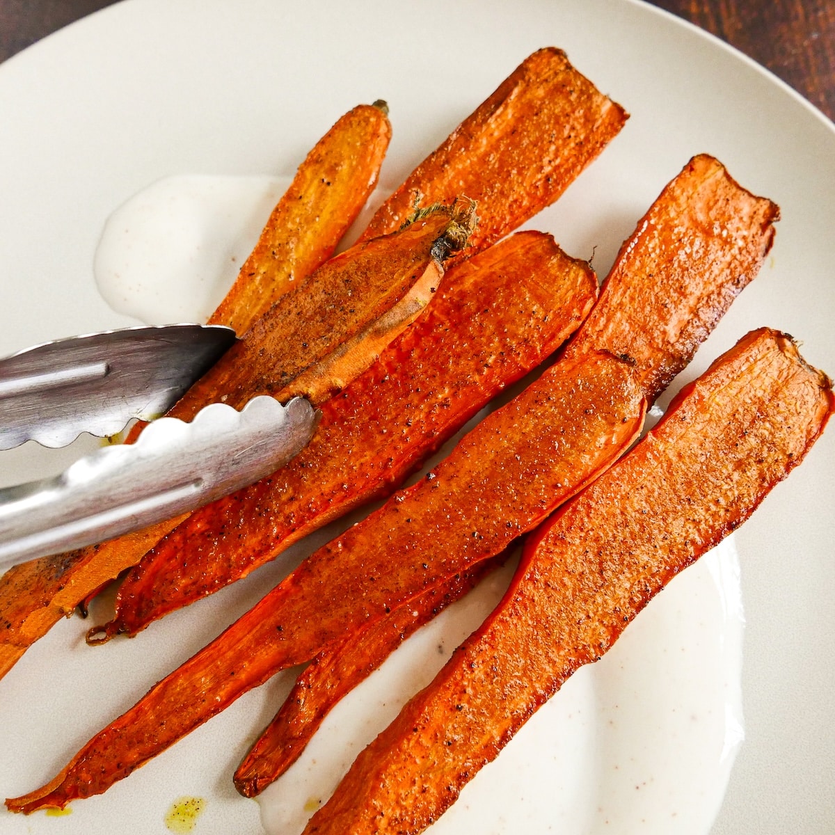 caramelized-roasted-carrots.jpg Caramelized roasted carrots with glossy edges.