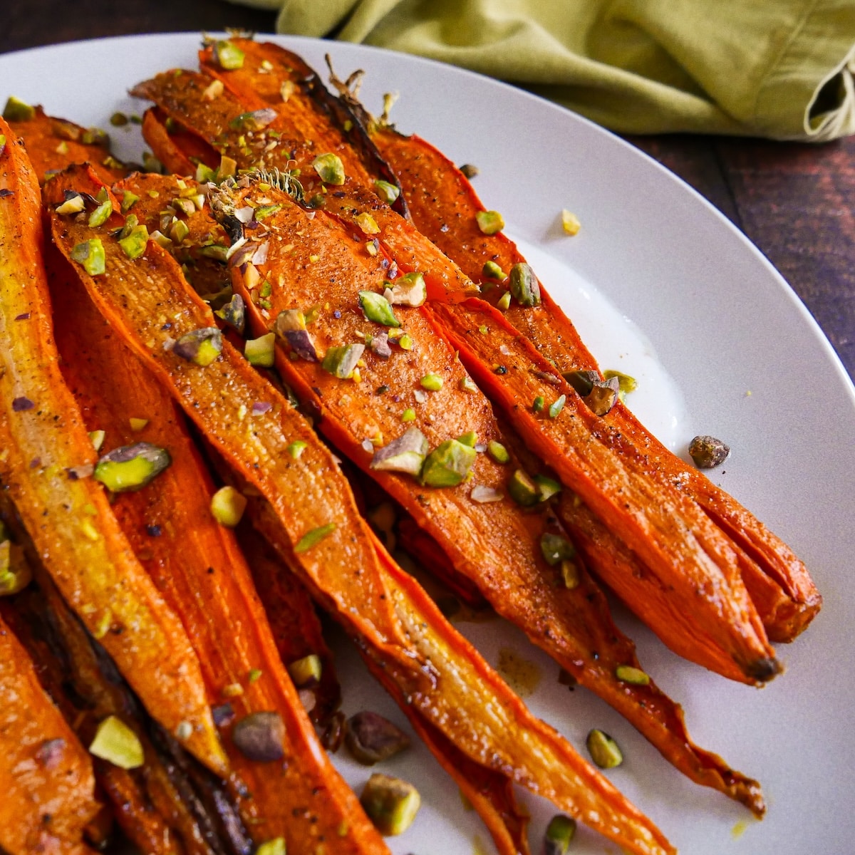 maple-roasted-carrots.jpg Caramelized maple roasted carrots over spiced yogurt, topped with pistachios and parsley.