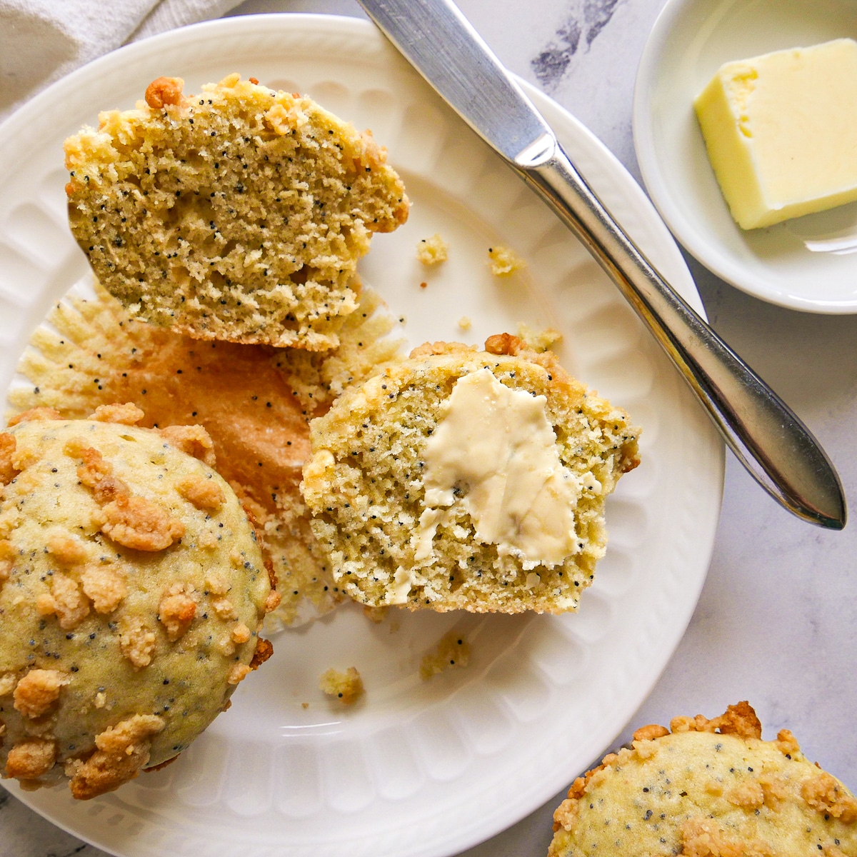 sliced-muffinsjpg Sliced almond poppy seed muffins on a plate.