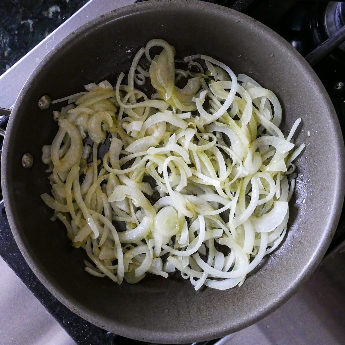 caramelized-onions.jpg Caramelized onions in a large skillet.