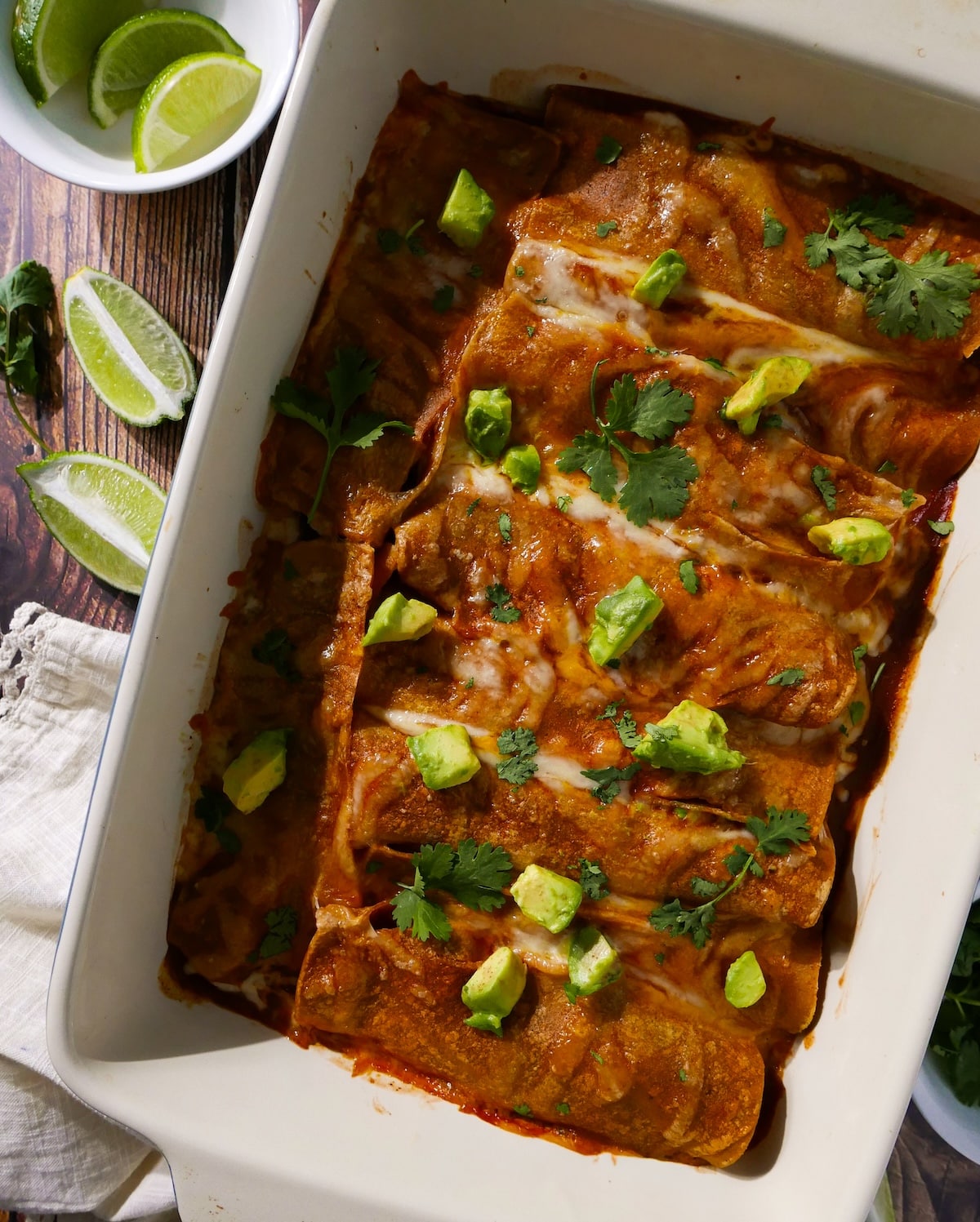 sweet-potato-enchilada-bake.jpg Sweet potato enchilada bake topped with avocado, cilantro, and lime.