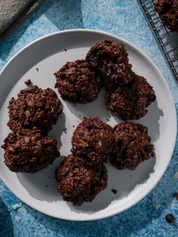 Plate of chewy chocolate coconut macaroons on a plate.