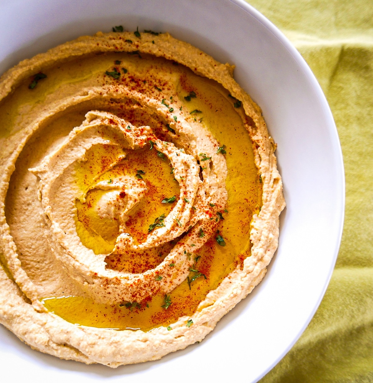 hummus-with-tahini.jpg Homemade hummus with tahini in a bowl.