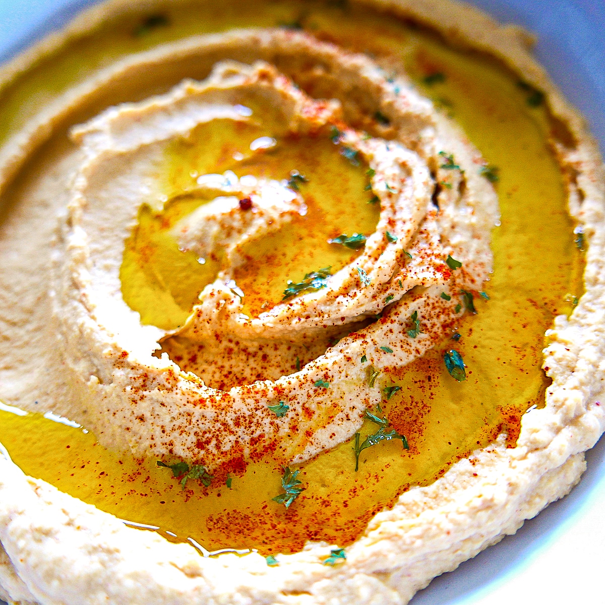 Creamy hummus with tahini in a bowl.