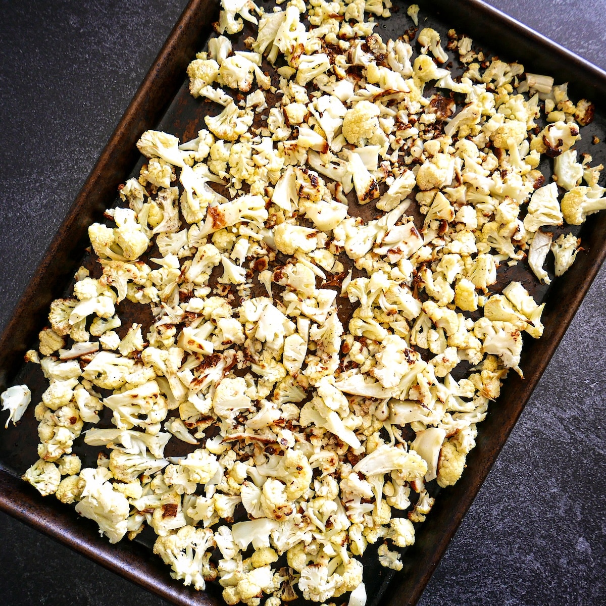 roasted-cauliflower.jpg Roasted cauliflower with crisp edges on a baking sheet.