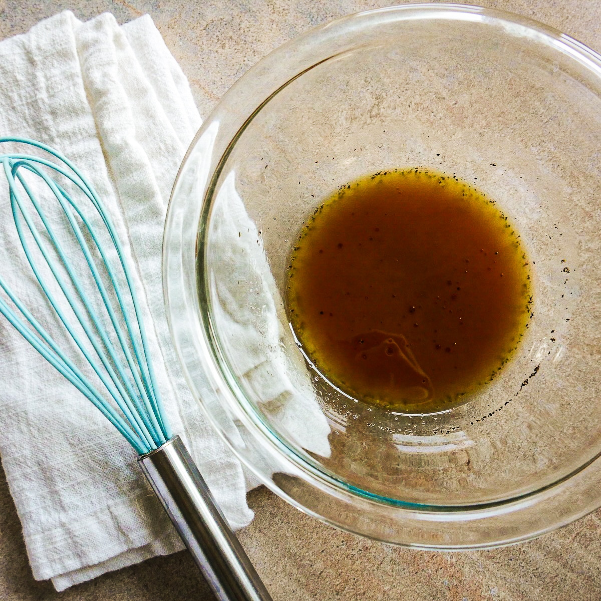 red-wine-vinaigrette.jpg Red wine vinaigrette whisked together in a small bowl.