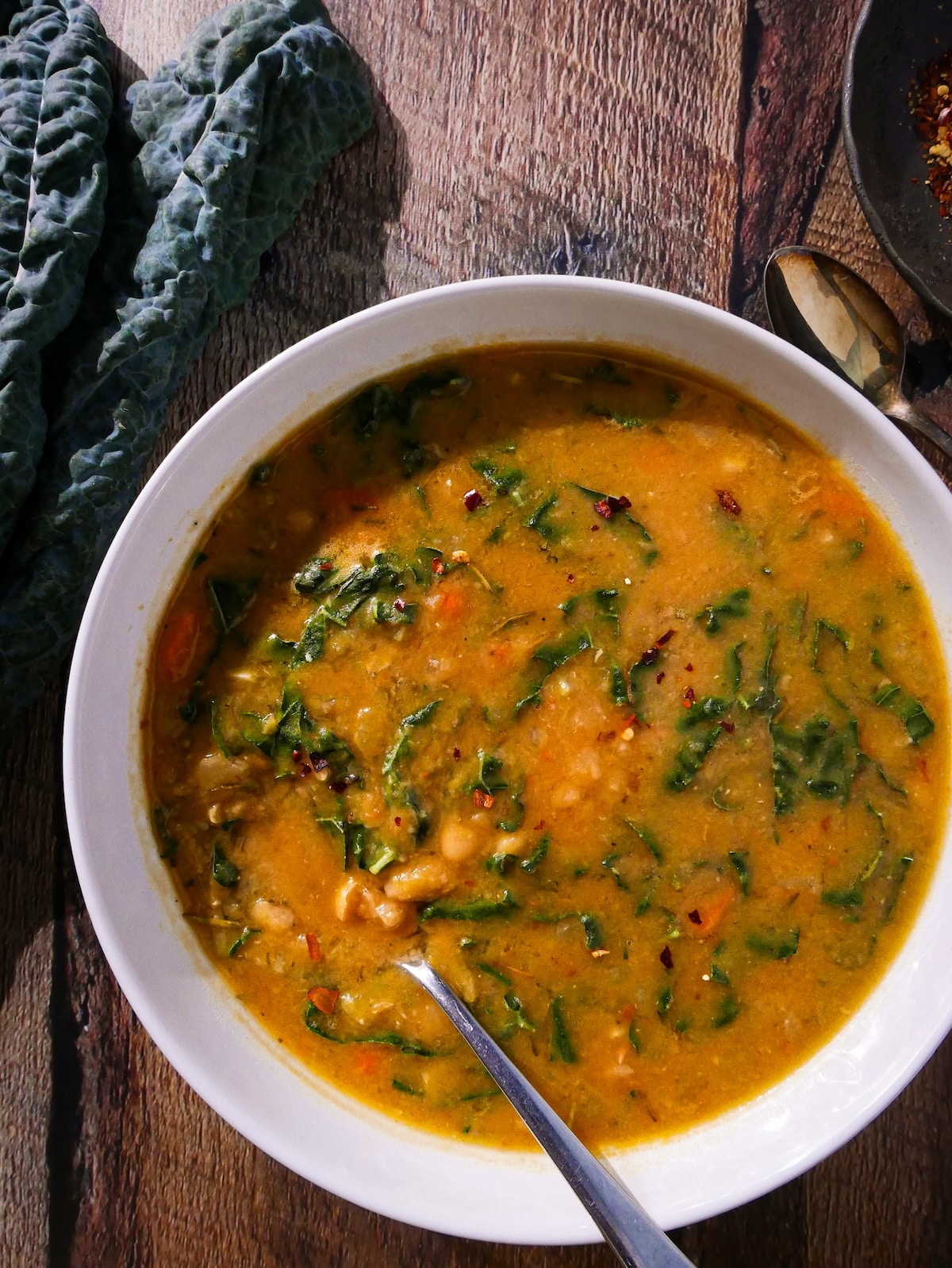 white-bean-soup.jpg White bean soup with kale in a bowl.