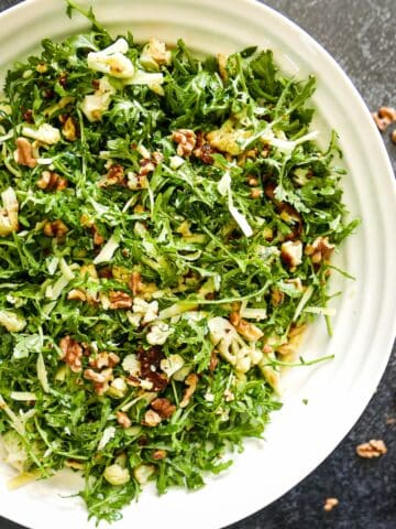 Warm roasted cauliflower salad with arugula.