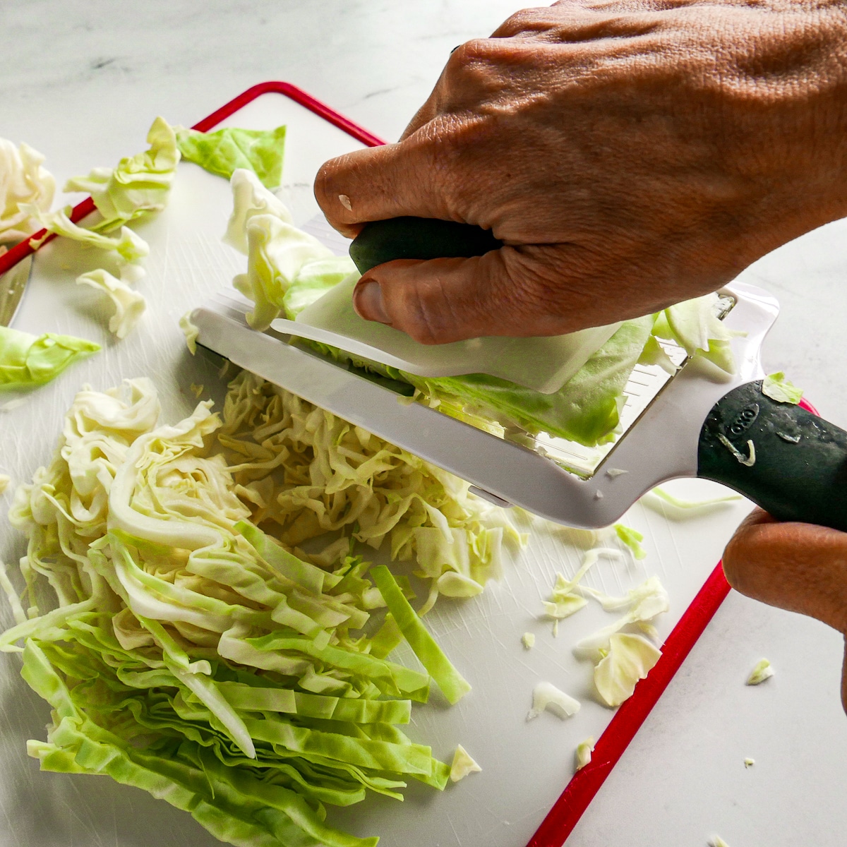 mandolin-sliced-cabbage.jpg Slicing green cabbage using a mandolin.