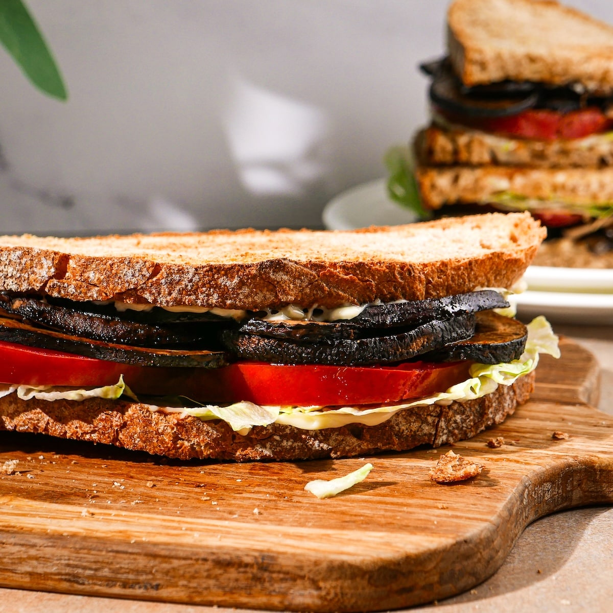 meatless-blt.jpg Assembled meatless blt with mushrooms on a plate.