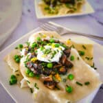 Easy wonton ravioli on a plate with a fork.