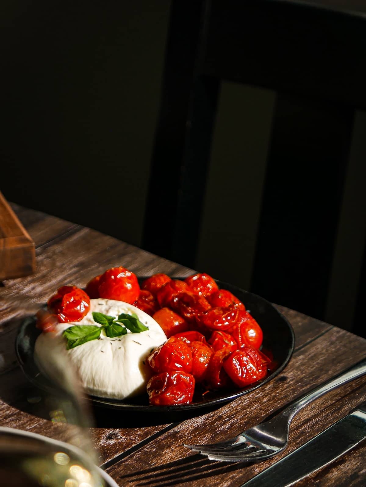 drizzling-sauce.jpg Roasted cherry tomatoes with burrata.