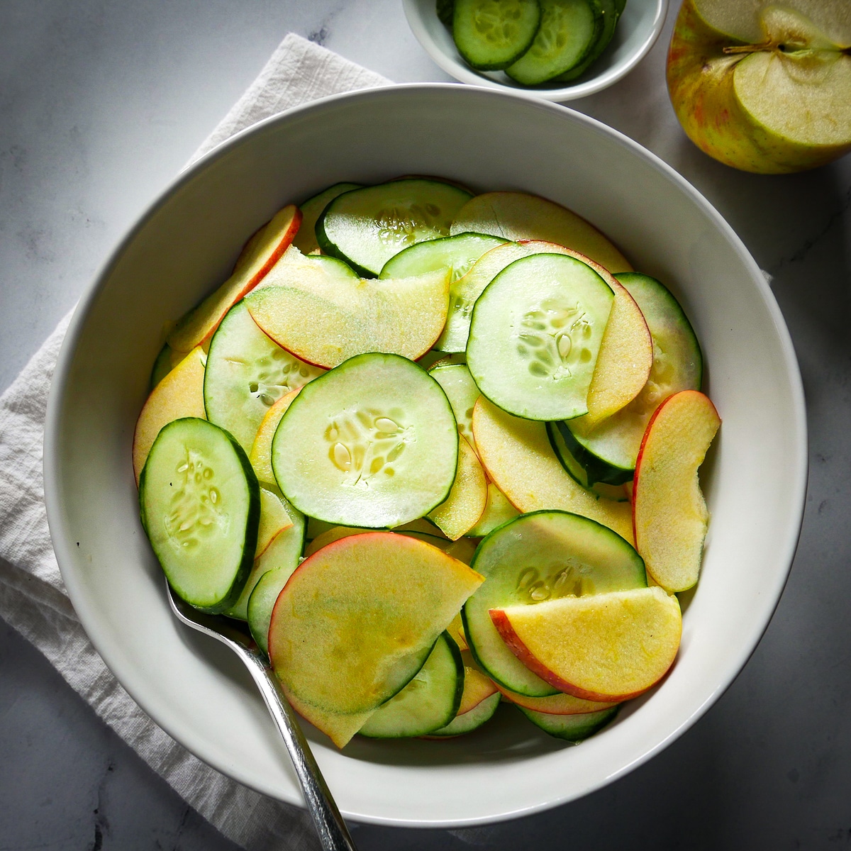 vegan-cucumber-salad.jpg Vegan cucumber salad in a bowl.