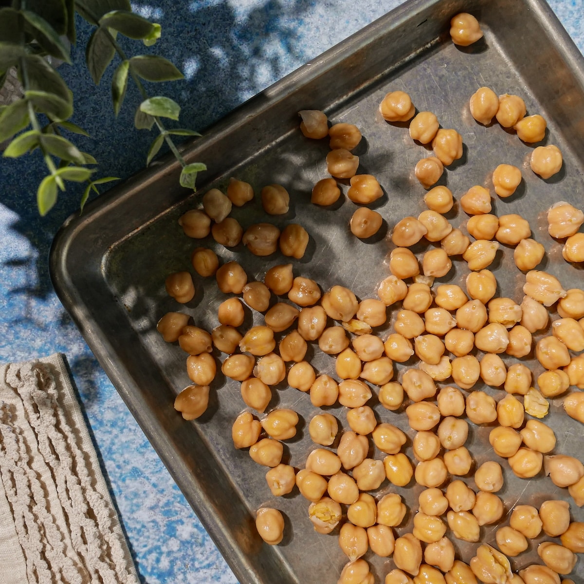 chickpeas-on-baking-sheet.jpg Chickpeas patted dry and spread out on a baking sheet.