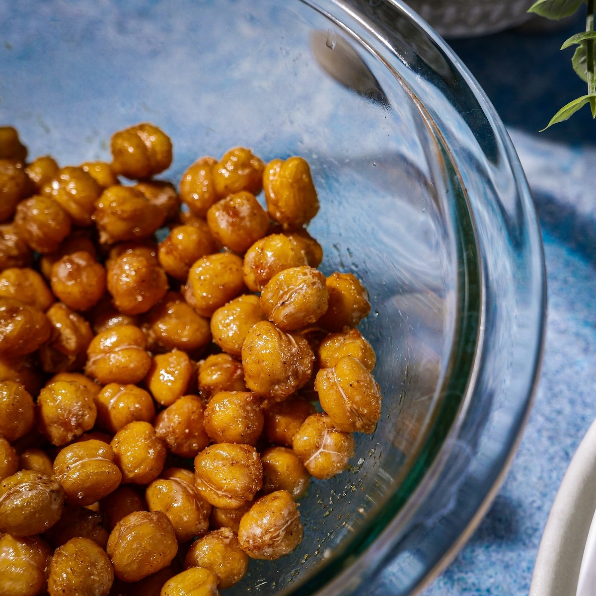 chickpeas-with-seasoning.jpg Roasted chickpeas tossed with oil and spices.