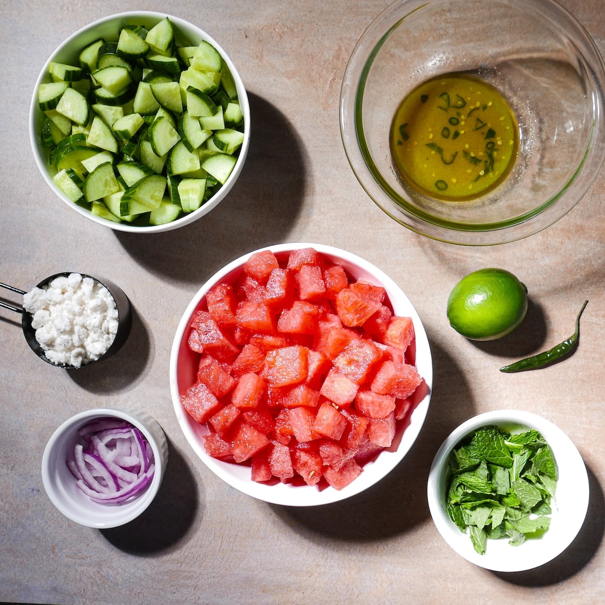 watermelon-salad-ingredients.jpg Watermelon salad ingredients arranged on a table.