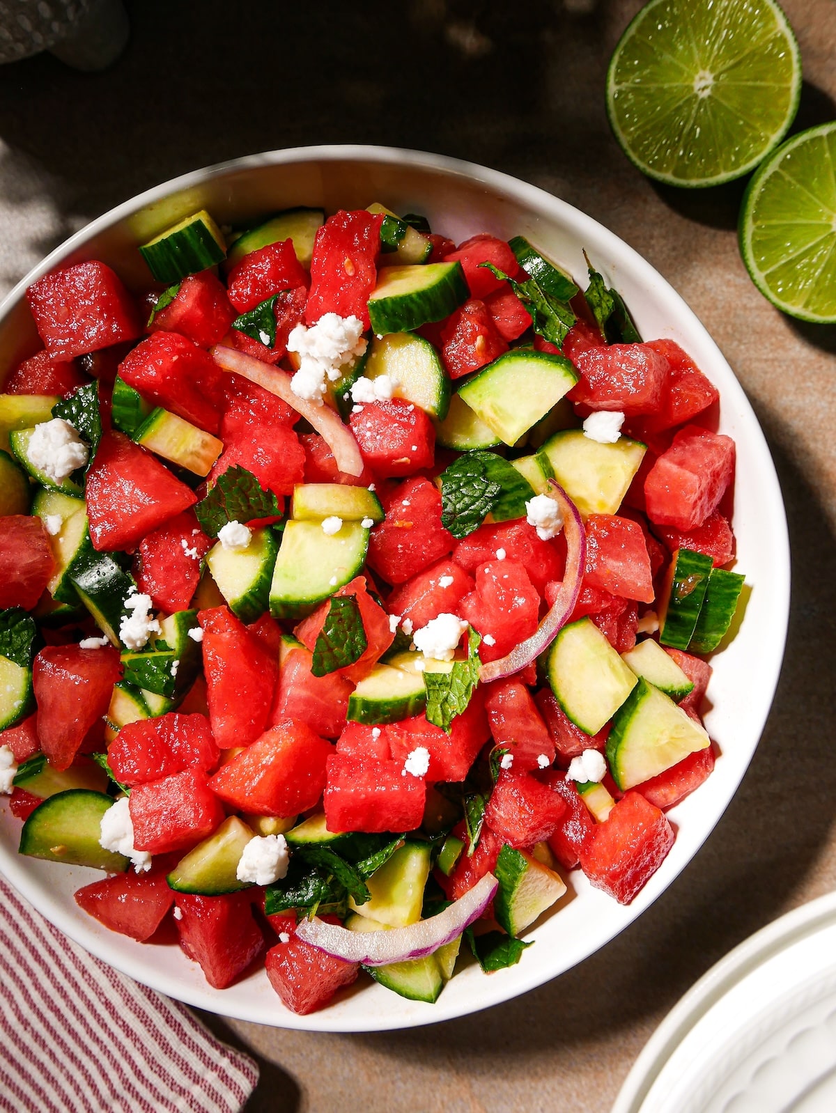 watermelon-summer-salad.jpg Watermelon feta salad with cucumber and mint in a bowl.