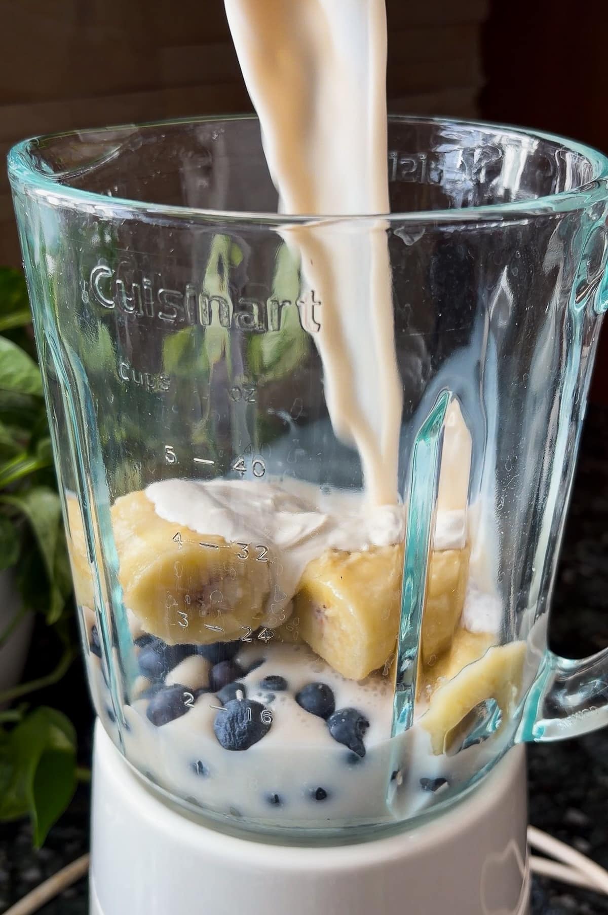 blending-smoothie-ingredients.jpg Blending smoothie ingredients in a blender.