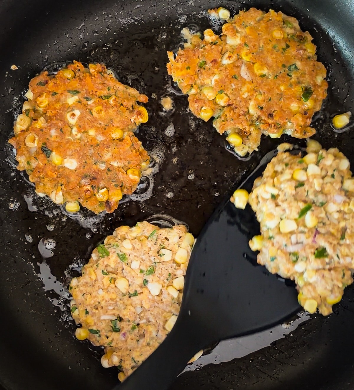 frying-fritters.jpg Cooking fritters in a skillet.