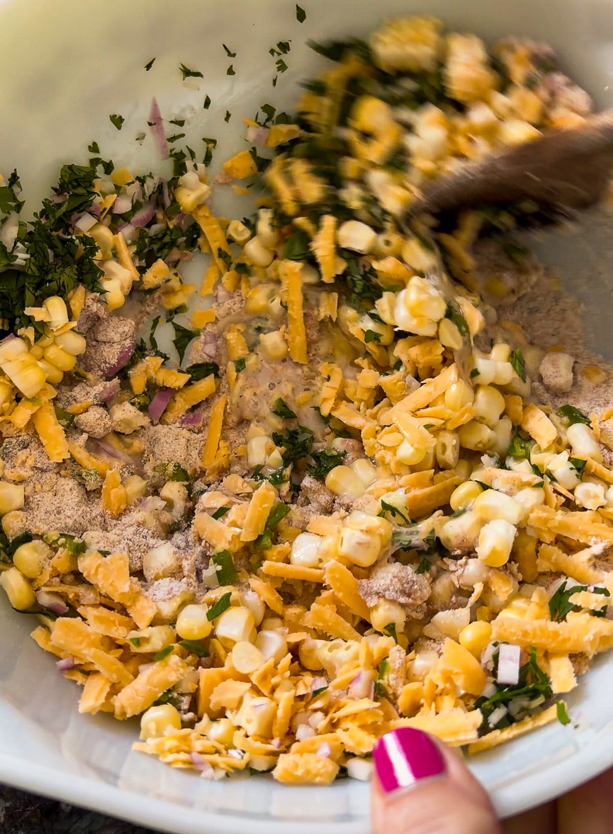 mixing-fritter-batter.jpg Mixing fritter batter in a bowl.