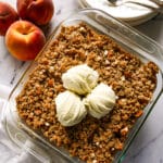 Gluten free peach crisp in a baking dish.