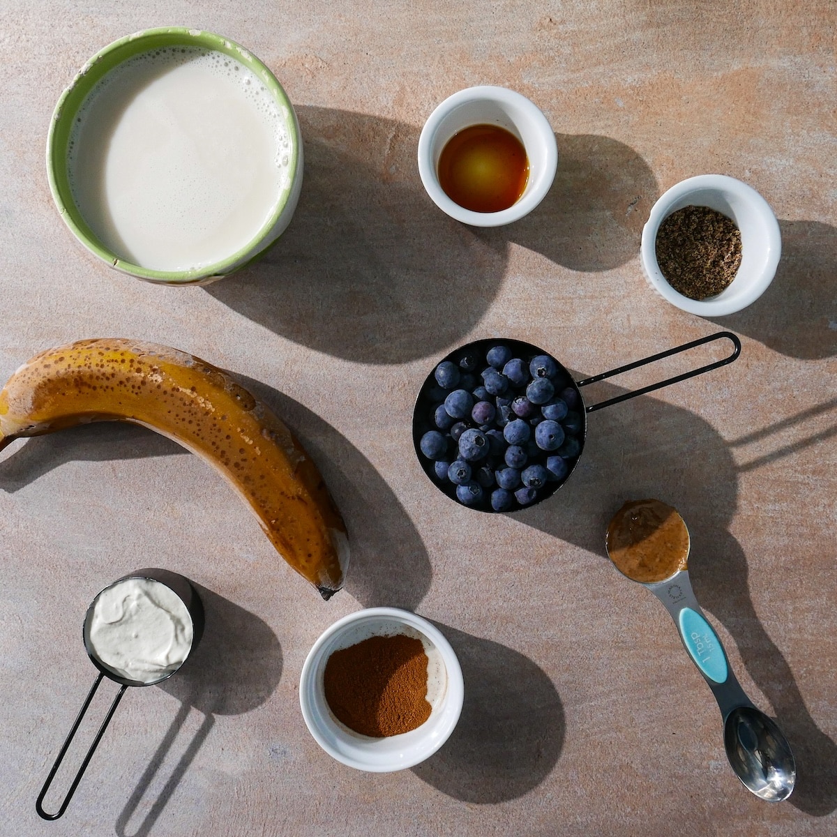 smoothie-ingredients.jpg Frozen banana smoothie ingredients on a table.