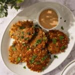 Crispy corn fritters with jalapeño on a plate.