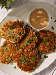Crispy corn fritters with jalapeño on a plate.