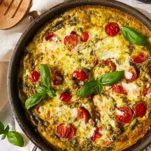 Baked frittata with vegetables, mozzarella, and basil.