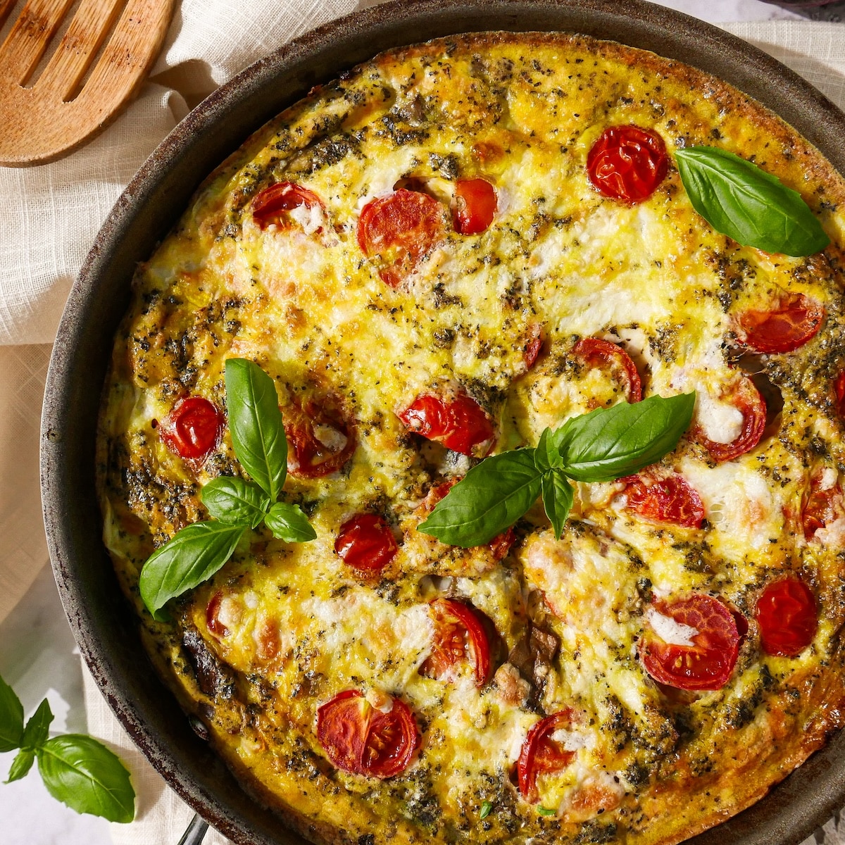baked-frittata.jpg Baked frittata with vegetables, mozzarella, and basil.