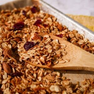 Crisp homemade granola on a baking sheet.