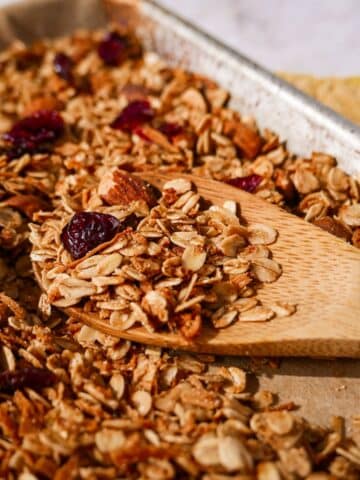 Crisp homemade granola on a baking sheet.