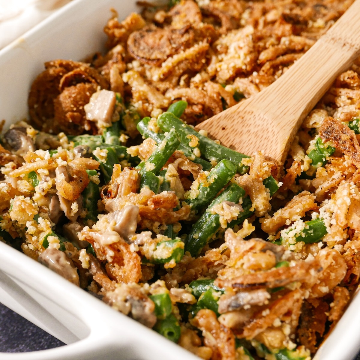 Green bean casserole with fresh green beans and crispy onions.