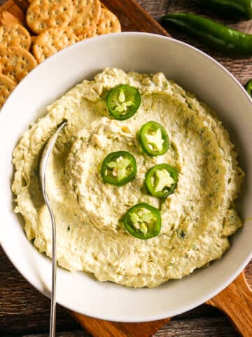 Creamy jalapeno artichoke dip in a bowl.